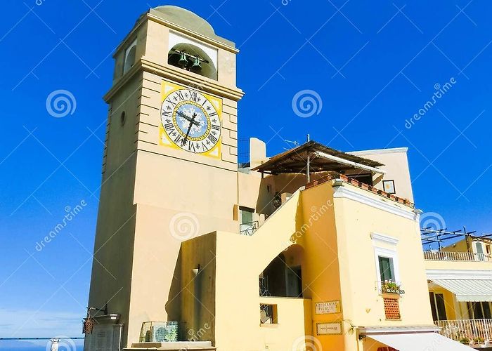 Piazza Umberto I Capri, Italy - May 04, 2014: Clocktower on Piazza Umberto I ... photo